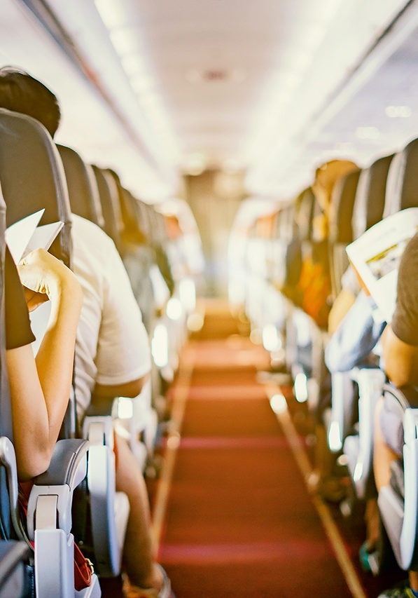 passenger seat, Interior of airplane with passengers sitting on